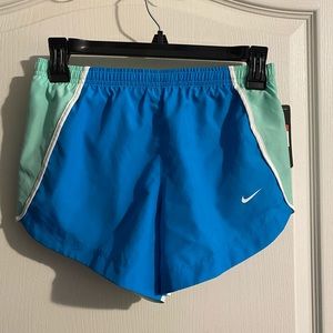 Girls Nike running shorts. Size large. New with tags